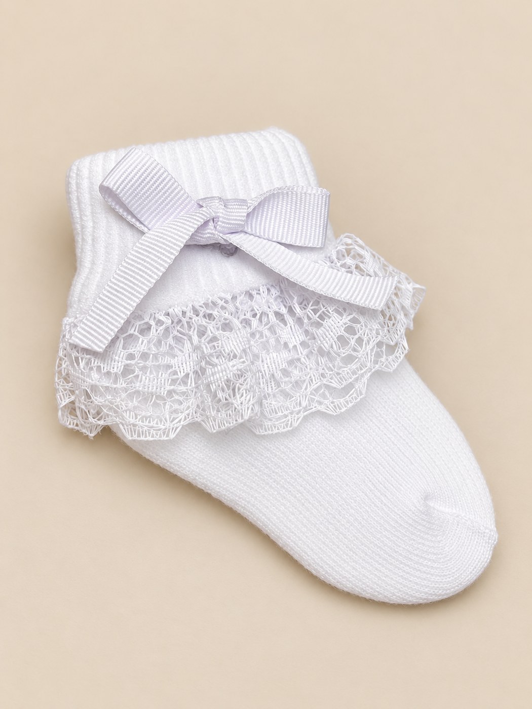 Medias para bebé con encaje y moño · Bolero